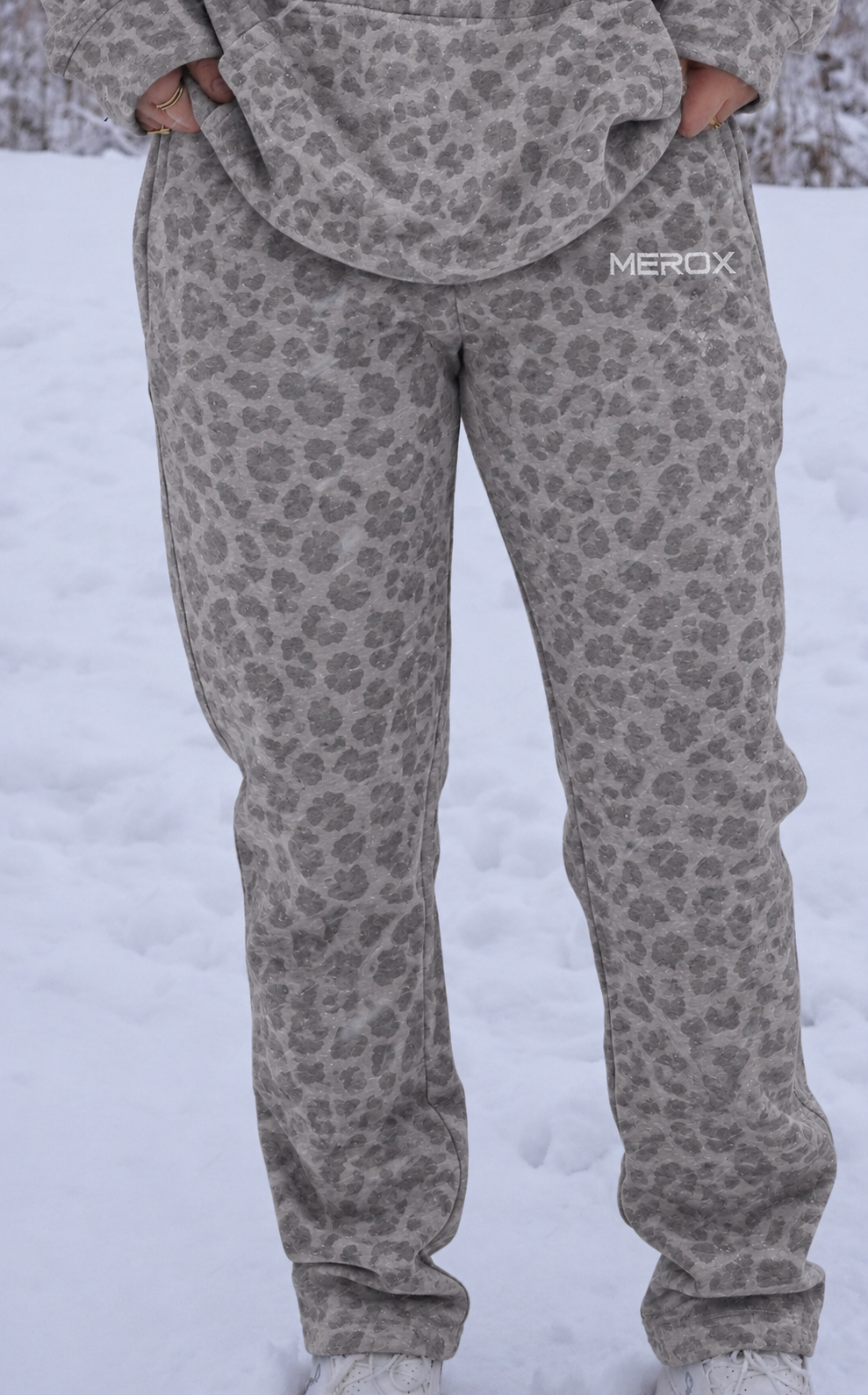 Female wearing the MEROX gray cheetah leopard joggers with straight hems