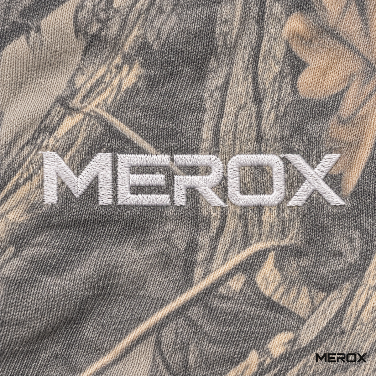 MEROX embroidered logo detail on vintage woodland camo joggers