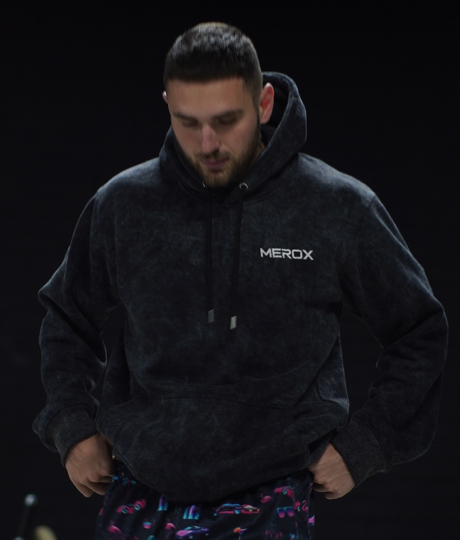 Owner wearing the MEROX Black Acid Wash embroidered hoodie; approved original photograph with mild face clarity adjustment