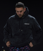 Owner wearing the MEROX Black Acid Wash embroidered hoodie; approved original photograph with mild face clarity adjustment