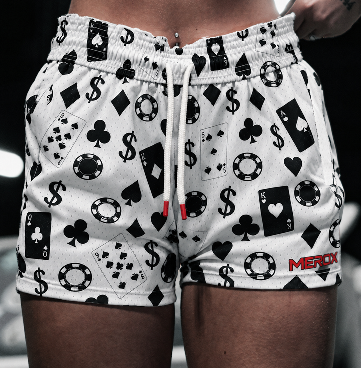 Woman wearing MEROX Casino 5-Inch Mesh Shorts; approved model photograph