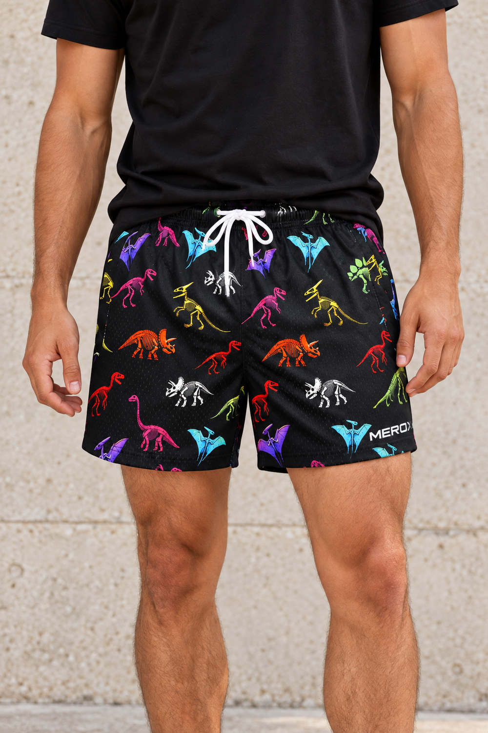Approved male model wearing MEROX Dinosaur mesh shorts, chest-down small-logo fit detail