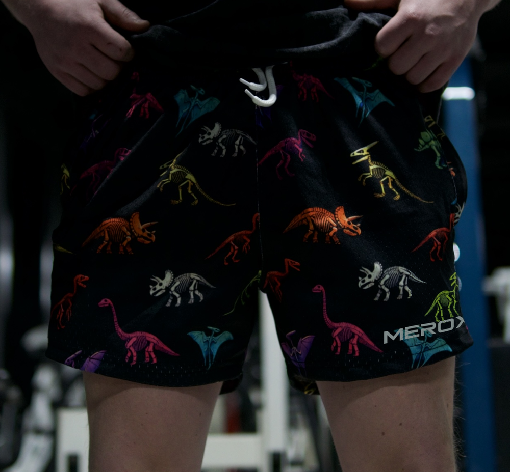 Approved male model wearing MEROX Dinosaur 5-inch mesh shorts