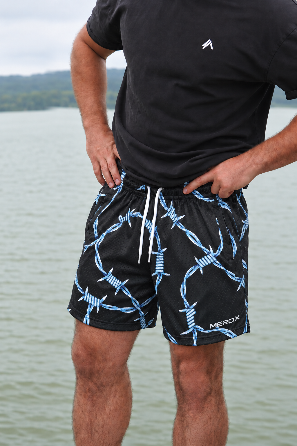 Man wearing MEROX Barbed Wire 5-inch mesh shorts