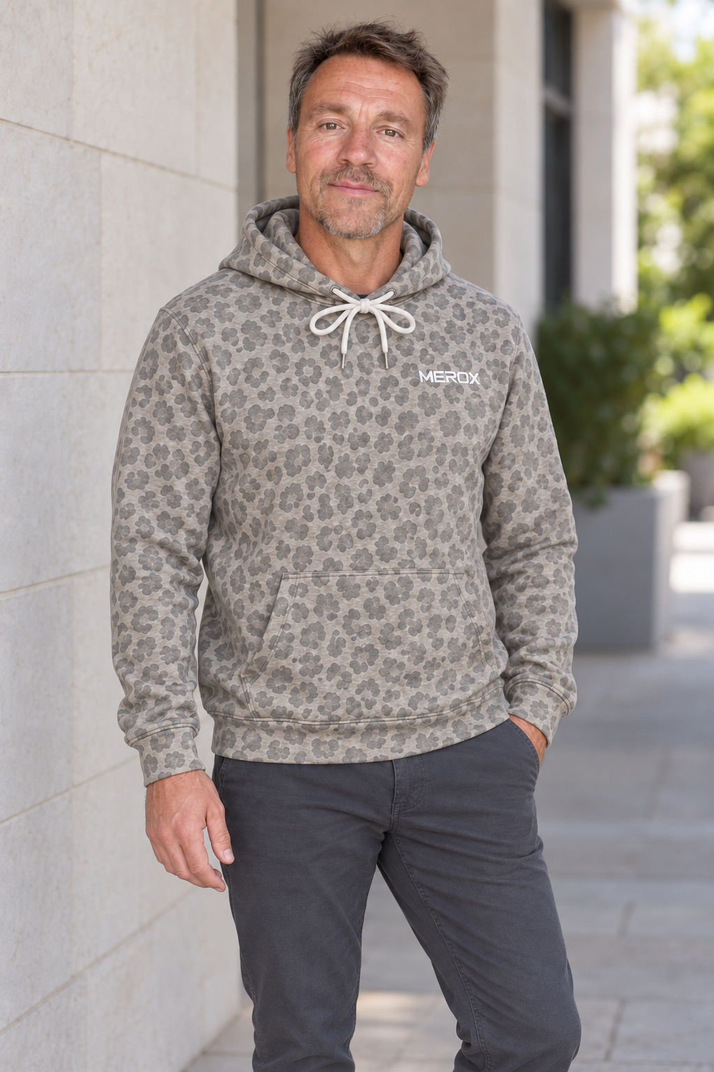 Male model wearing the approved MEROX gray cheetah leopard embroidered hoodie
