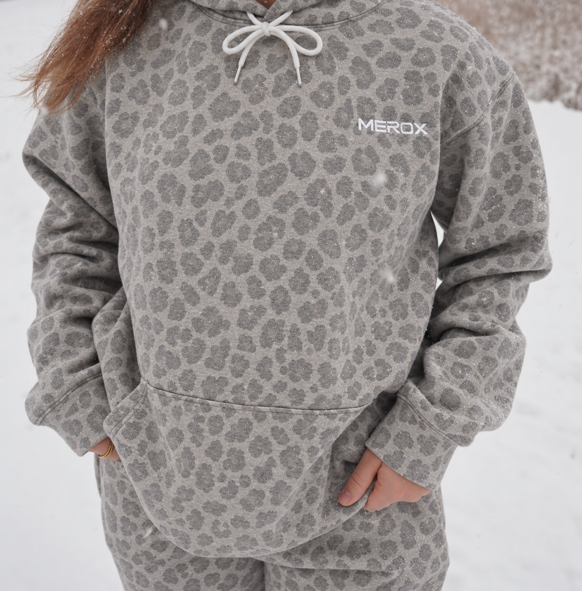 Female wearing the MEROX gray cheetah leopard hoodie