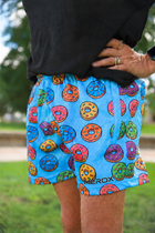 Model wearing MEROX Donut 5-inch mesh shorts