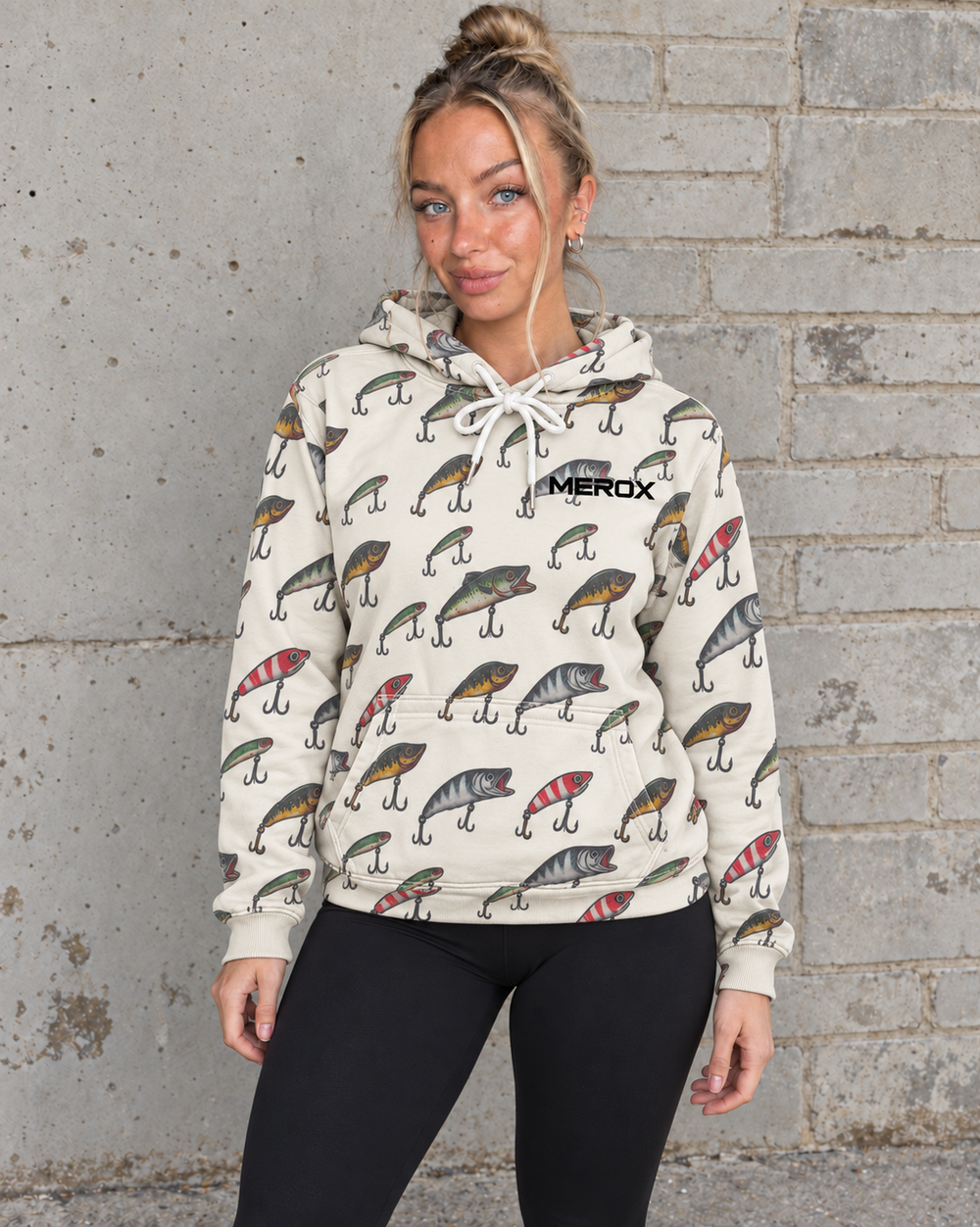 Woman wearing the cream MEROX Fishing Lure hoodie