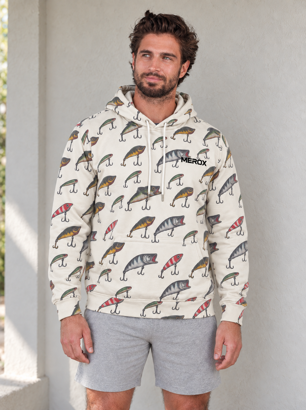 Miles wearing the cream MEROX Fishing Lure hoodie