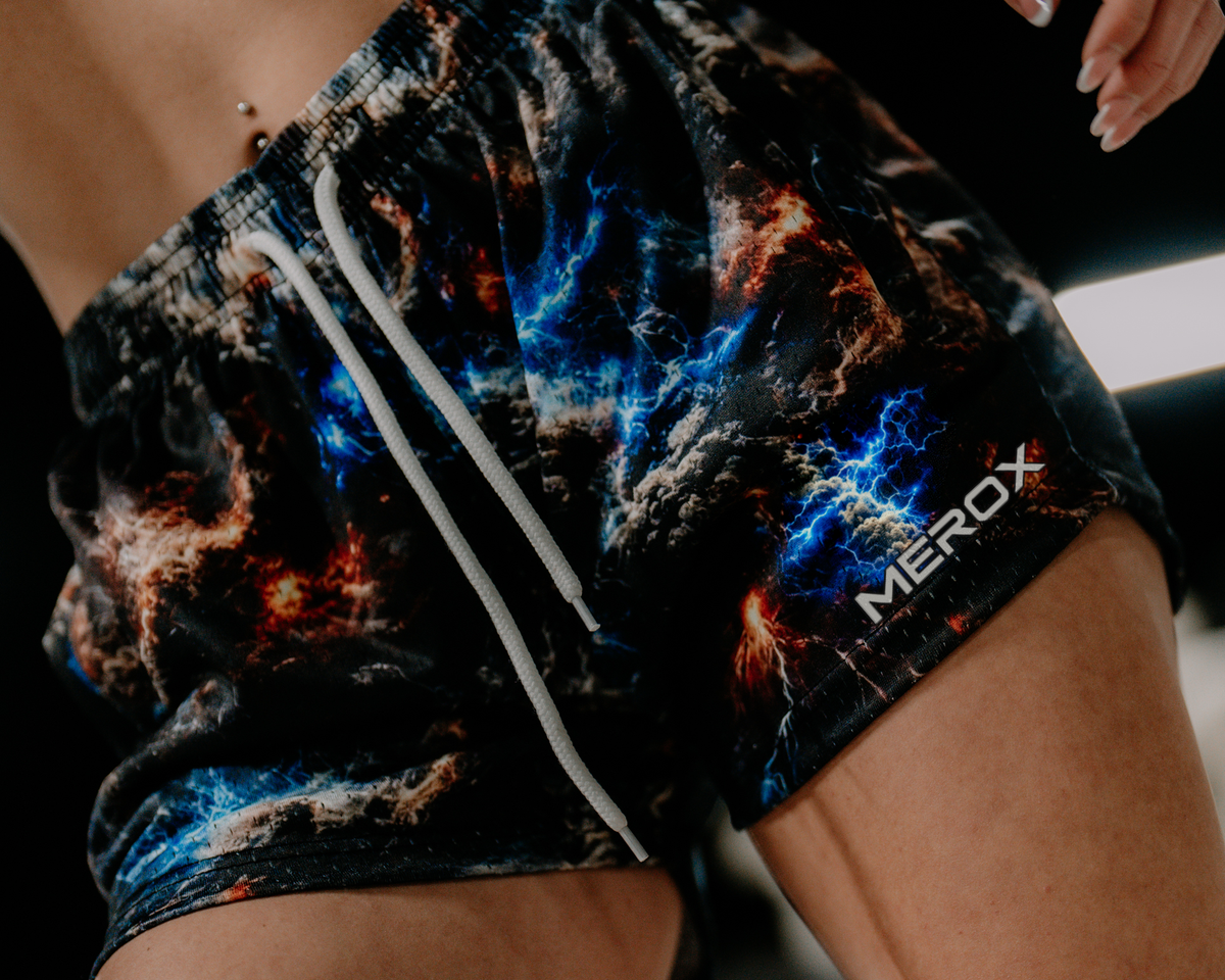 Approved female model wearing MEROX Galaxy Storm Cloud mesh shorts