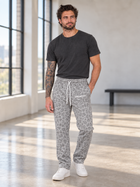 Miles wearing MEROX gray cheetah leopard joggers
