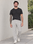 Male model wearing MEROX gray joggers outdoors