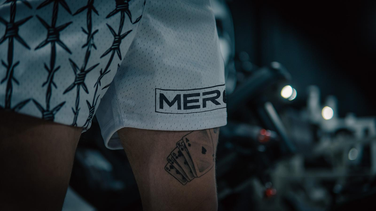 Approved male model wearing MEROX White Half Barbed Wire mesh shorts