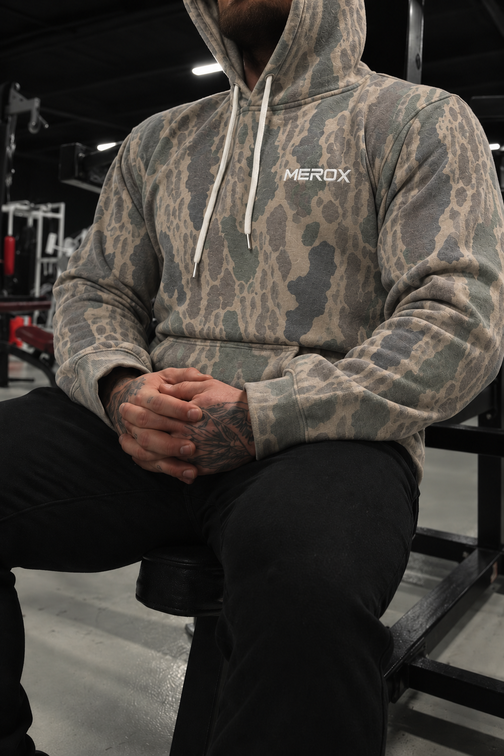 Approved male model wearing MEROX Old School Camo hoodie