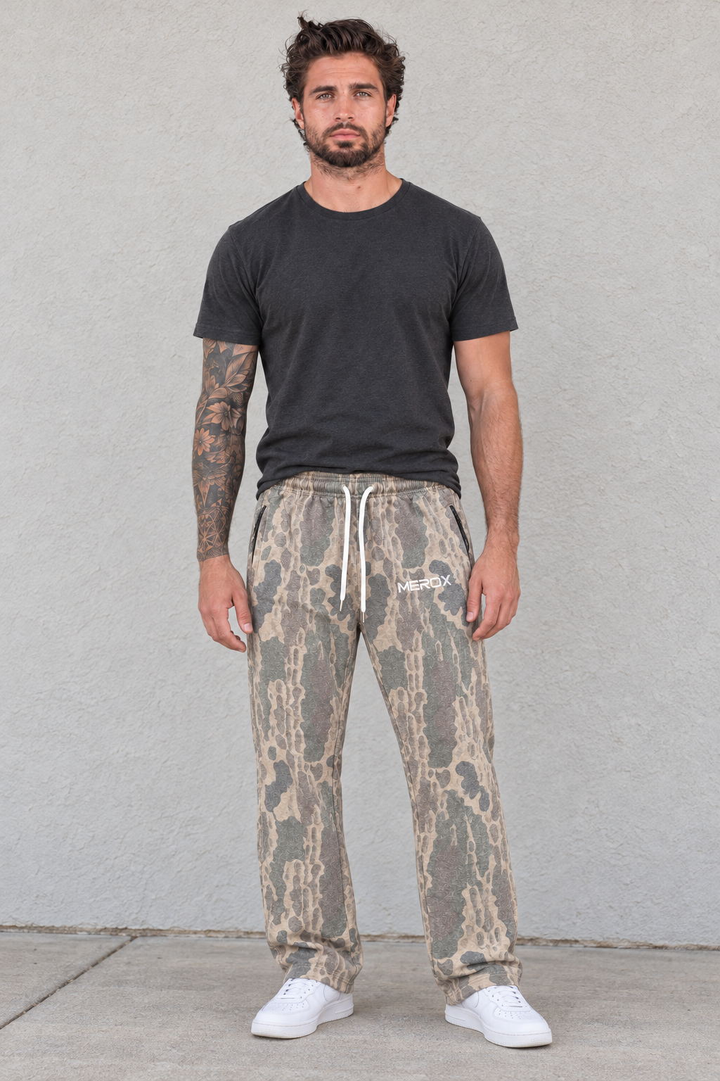 Man wearing MEROX Old School Camo joggers with open hems