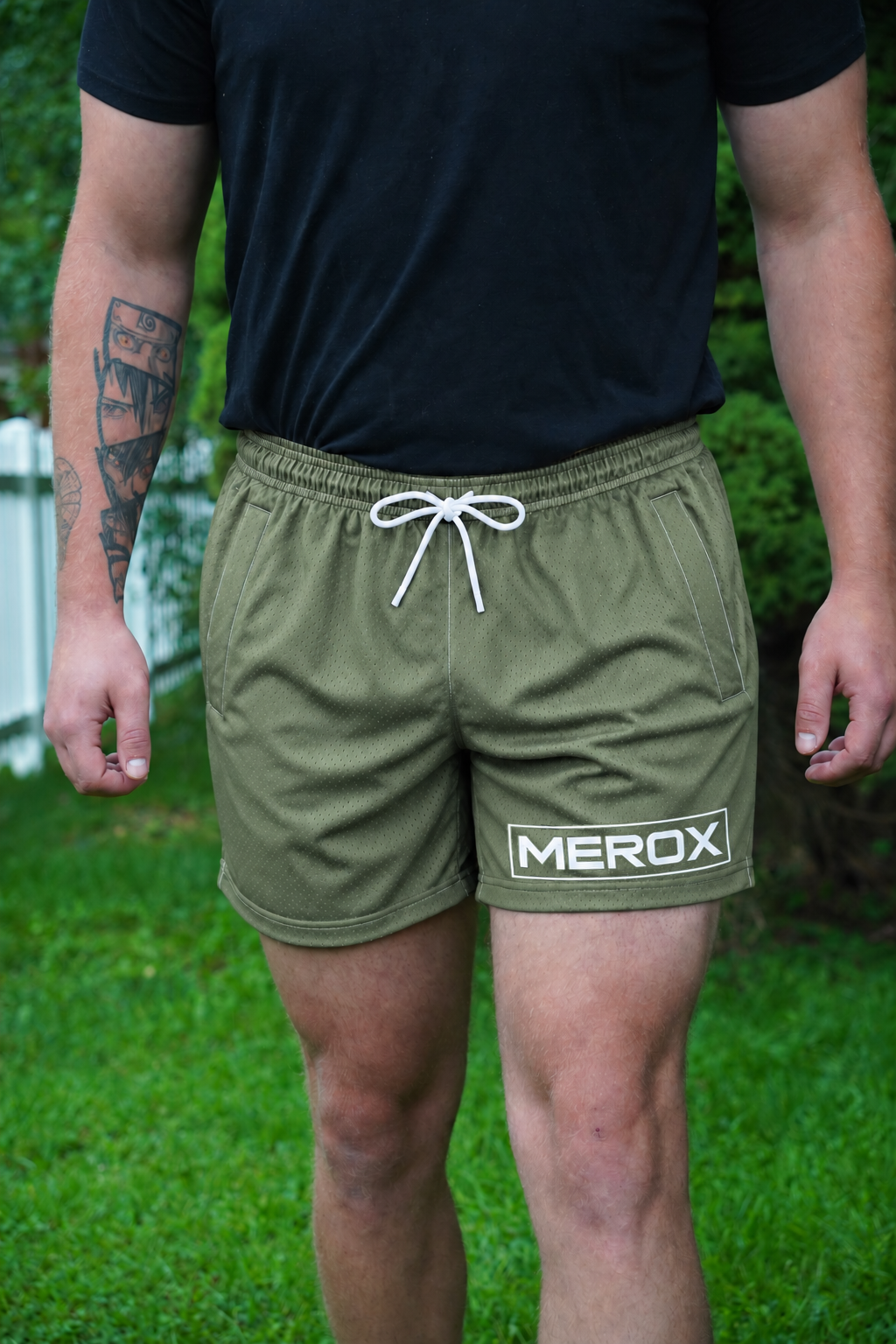 Approved male model wearing MEROX Olive Green mesh shorts