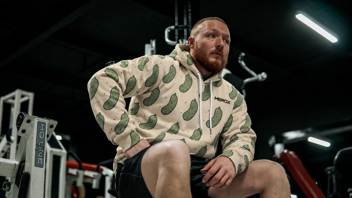 Man wearing MEROX Pickle embroidered hoodie, approved model photograph