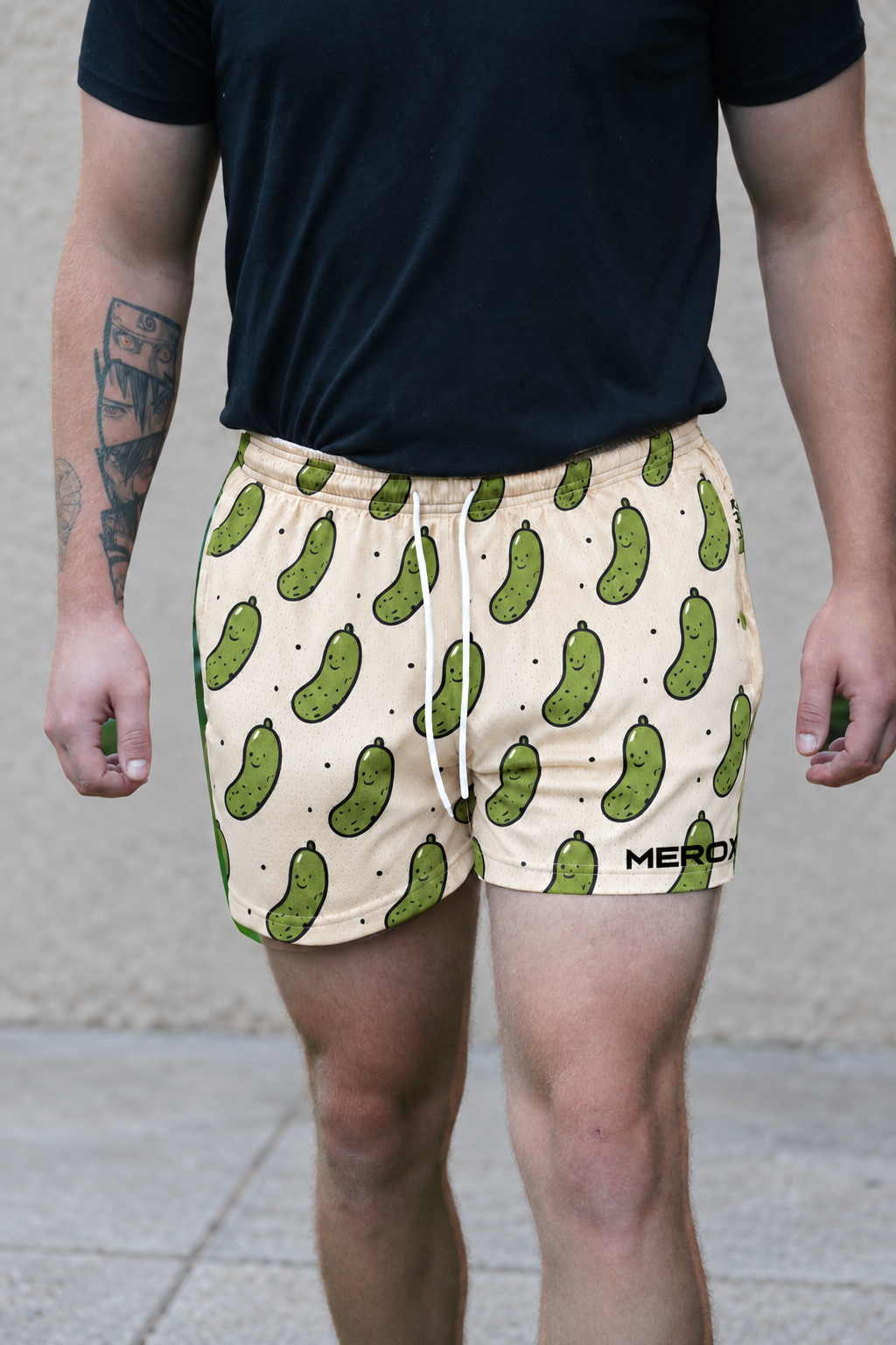 Man wearing MEROX Pickle 5-inch mesh shorts