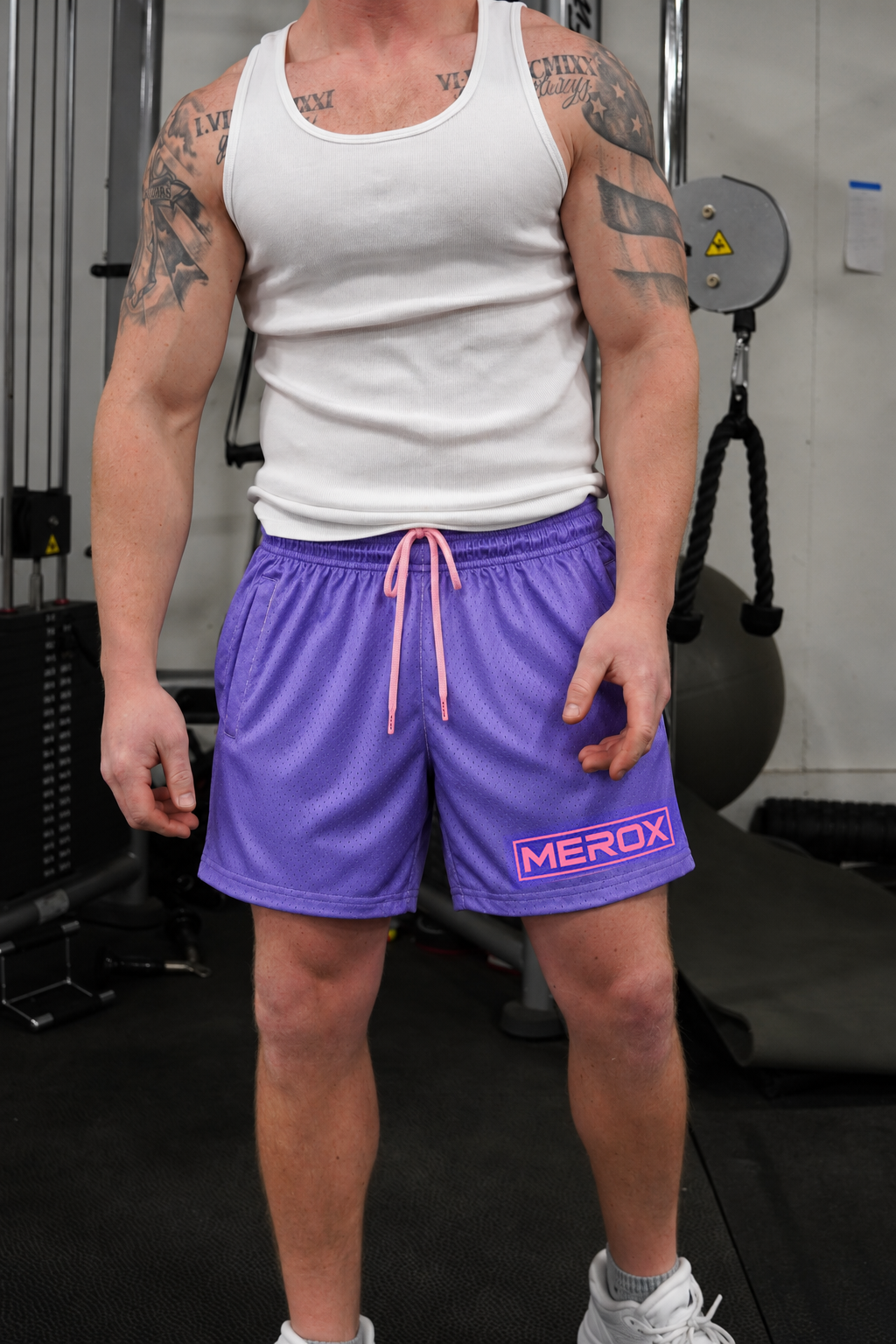 Man wearing MEROX Purple and Pink mesh shorts