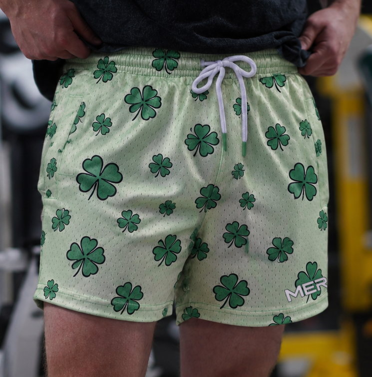 Man wearing MEROX Shamrock 5-inch mesh shorts