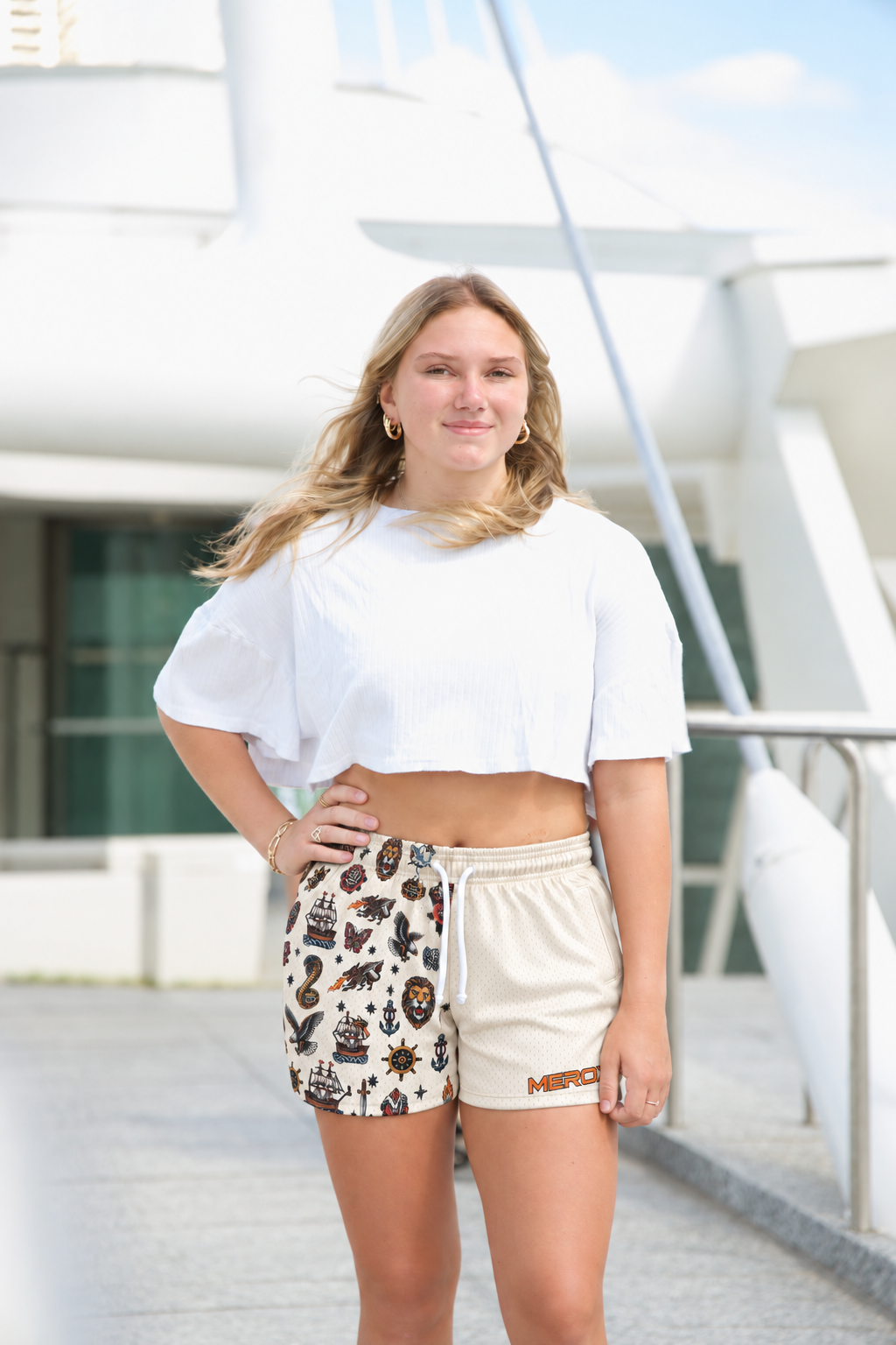 Approved female model wearing MEROX Traditional Tattoo mesh shorts