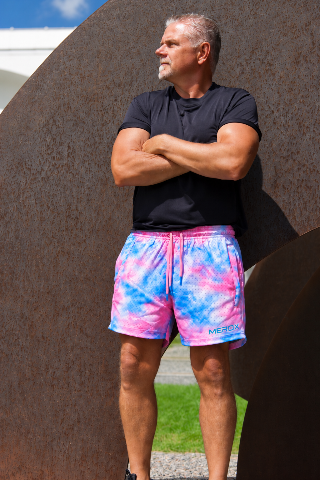 Man wearing MEROX Pink and Blue Tie-Dye mesh shorts, approved tighter framing