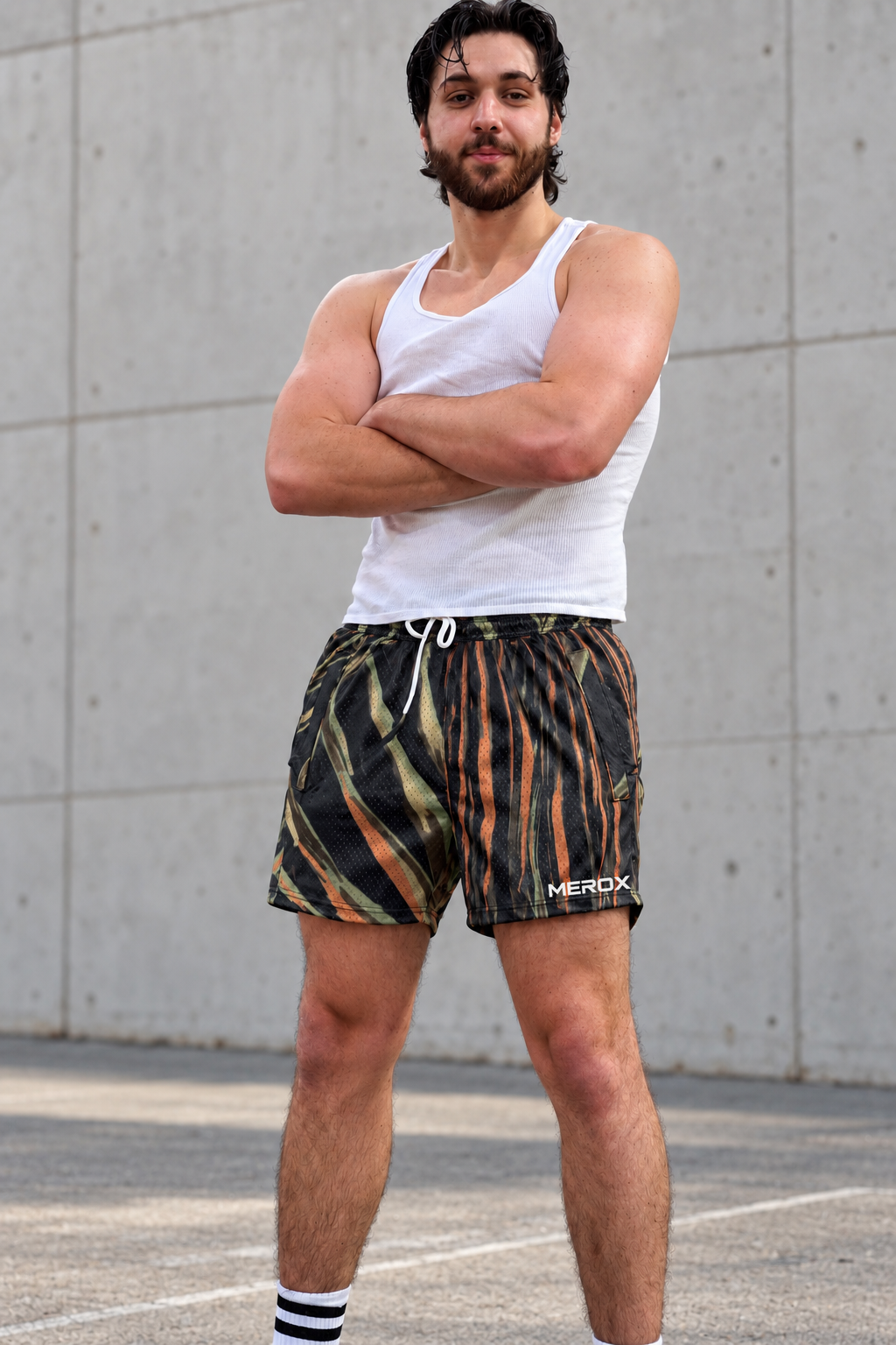 Man wearing MEROX Tiger Camo 5-inch mesh shorts