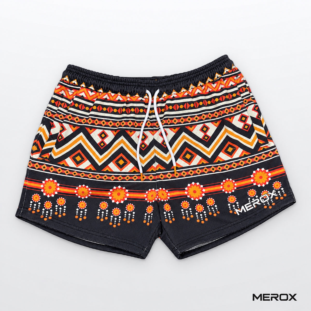 MEROX Tribal mesh shorts, front view with orange, cream and black Aztec geometric print