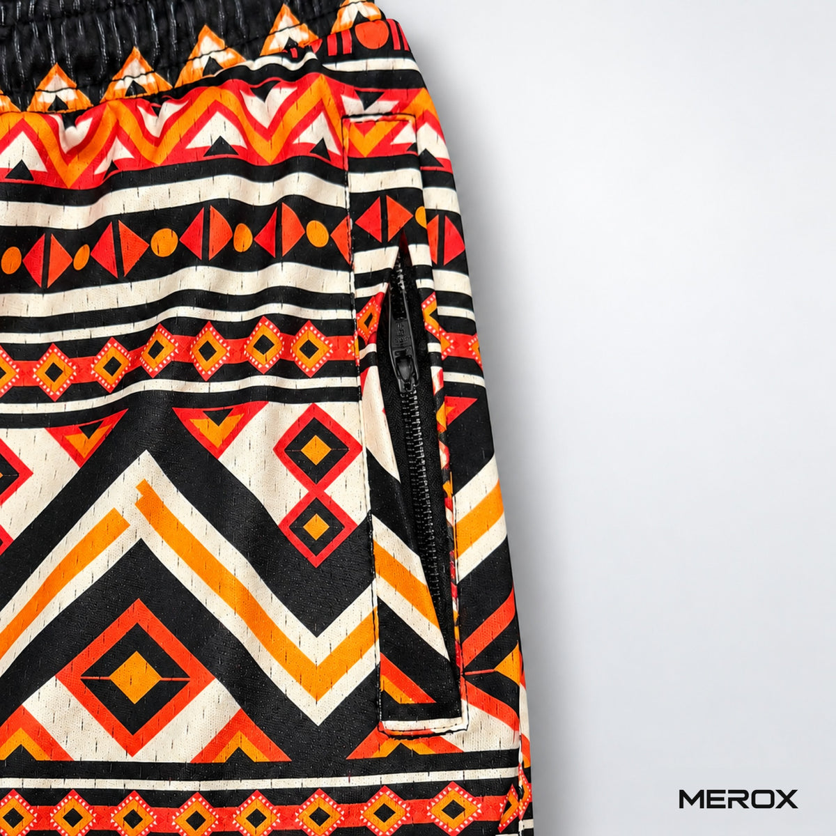 Close-up of zippered side pocket and breathable mesh on MEROX Tribal shorts