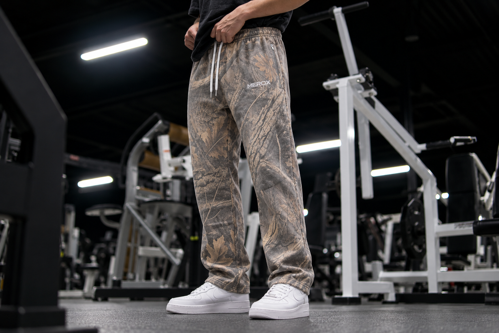 Approved male model wearing MEROX Vintage Woodland Camo joggers