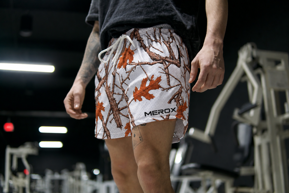 Man wearing MEROX White Camo 5-inch mesh shorts