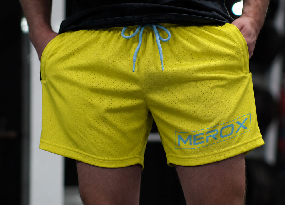 Man wearing MEROX Yellow & Blue shorts