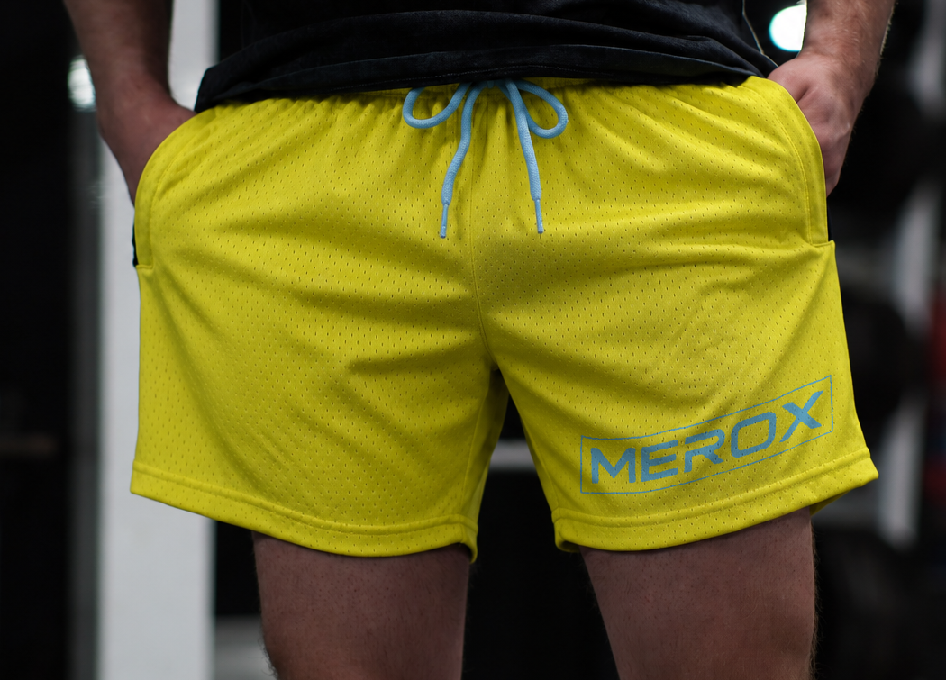 Man wearing MEROX Yellow & Blue shorts